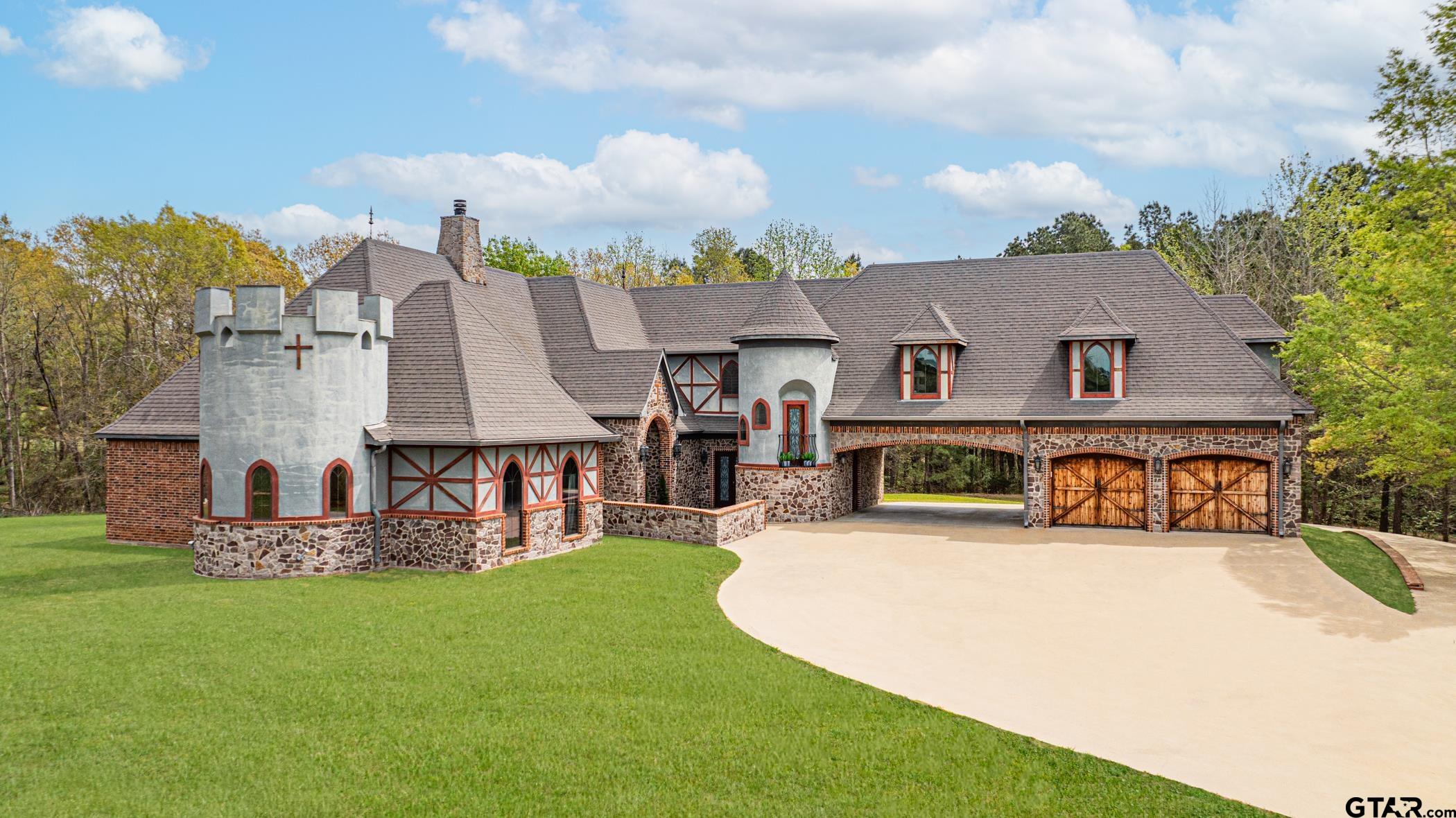 a view of a house with swimming pool and a yard
