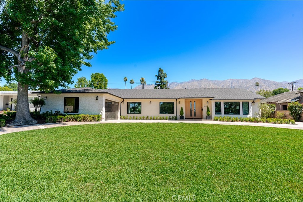 3755 Hampton Road Pasadena, CA 91107 - Photo 1 of 1 a front view of a house with a garden