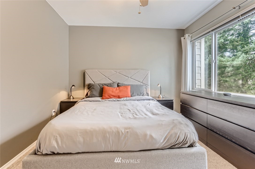 13400 Dumas Road, Unit E3 Mill Creek, WA 98012 - Photo 17 of 28 a bedroom with a bed and window