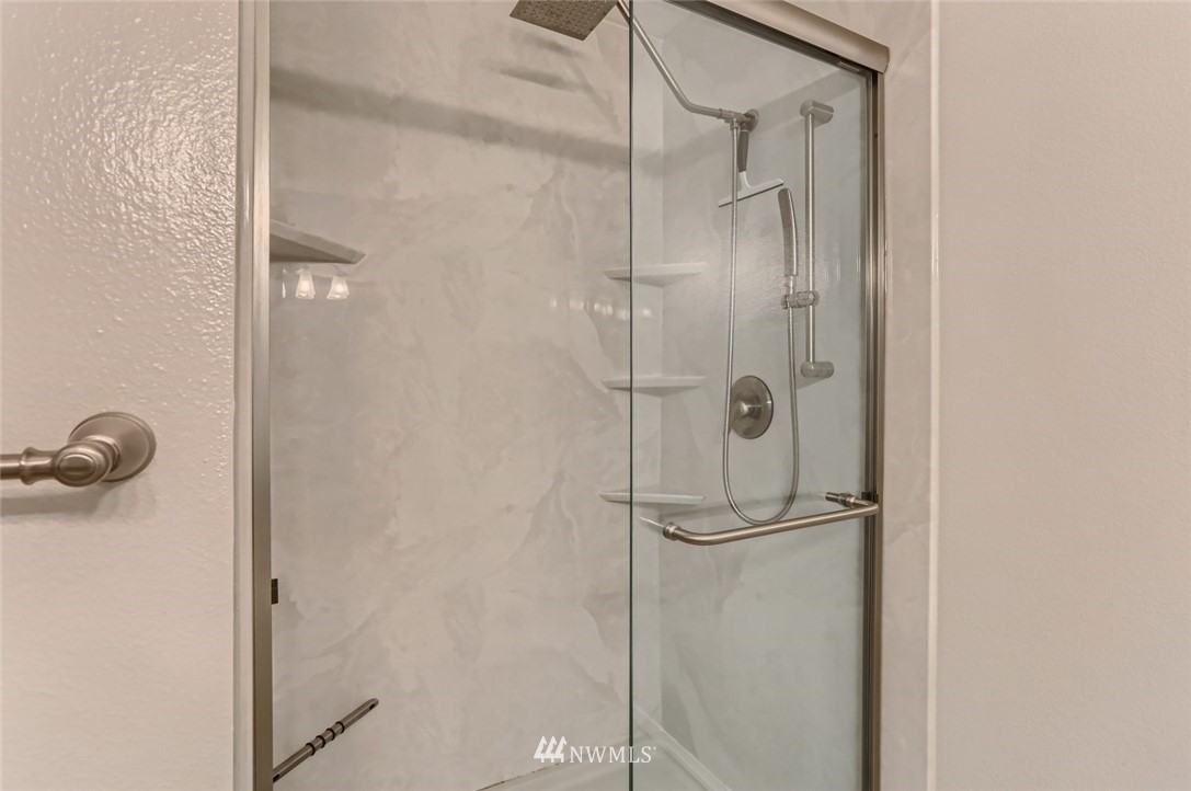 13400 Dumas Road, Unit E3 Mill Creek, WA 98012 - Photo 19 of 28 a bathroom with a glass shower door
