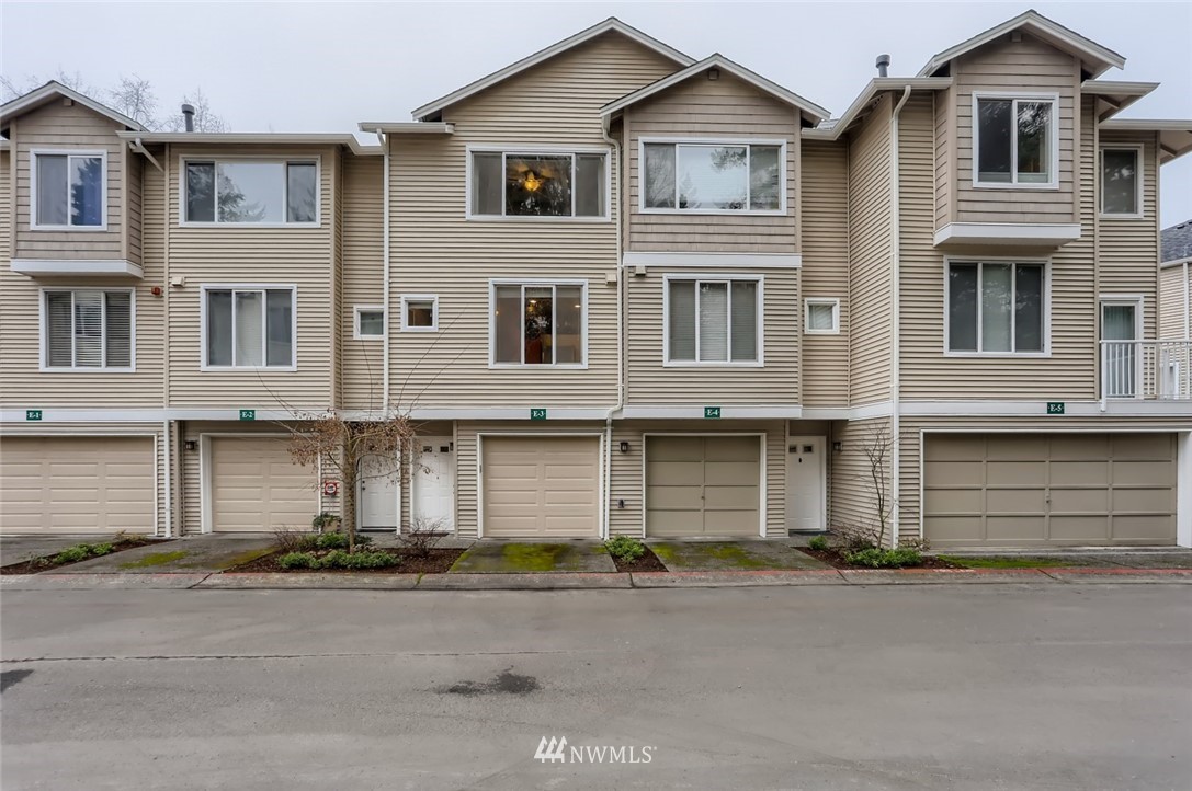 13400 Dumas Road, Unit E3 Mill Creek, WA 98012 - Photo 3 of 28 a front view of a house with a yard and parking space
