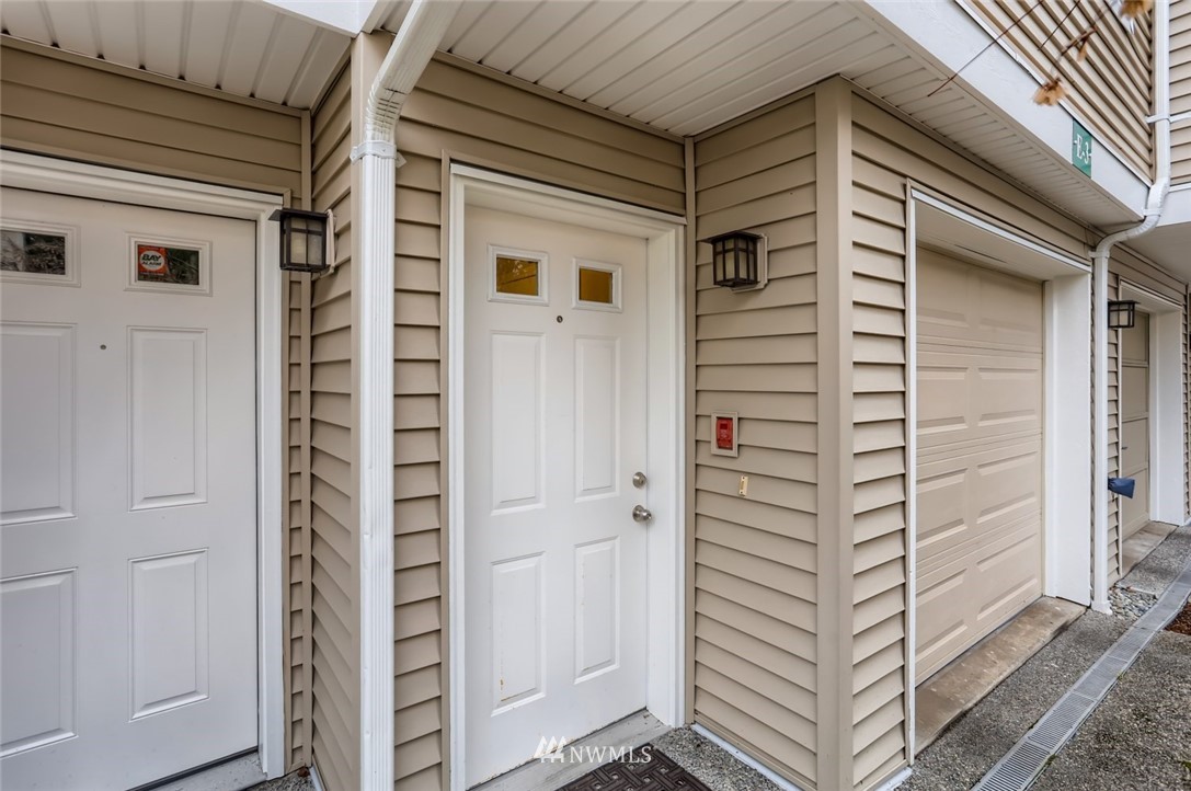 13400 Dumas Road, Unit E3 Mill Creek, WA 98012 - Photo 5 of 28 a view of front door and potted plants
