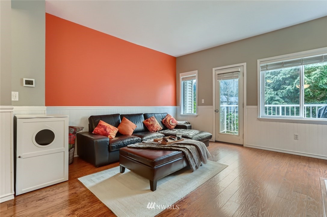 13400 Dumas Road, Unit E3 Mill Creek, WA 98012 - Photo 6 of 28 a living room with furniture and a floor to ceiling window