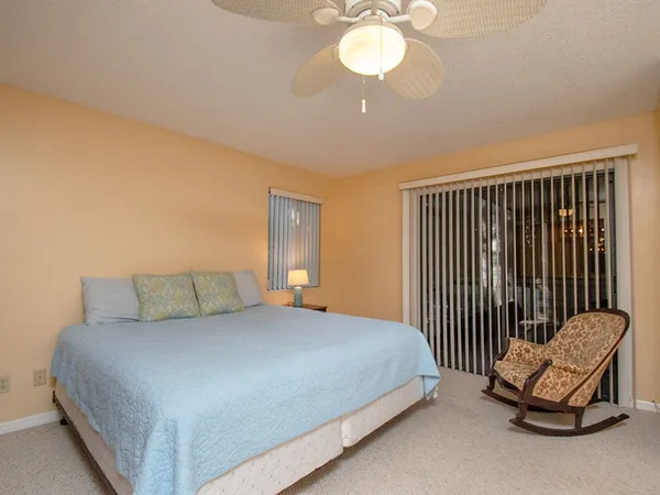 a bedroom with a bed and a chair