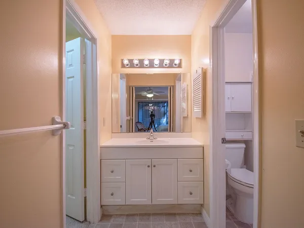 a view of a hallway view with mirror and window