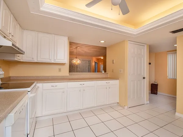 a kitchen with white cabinets