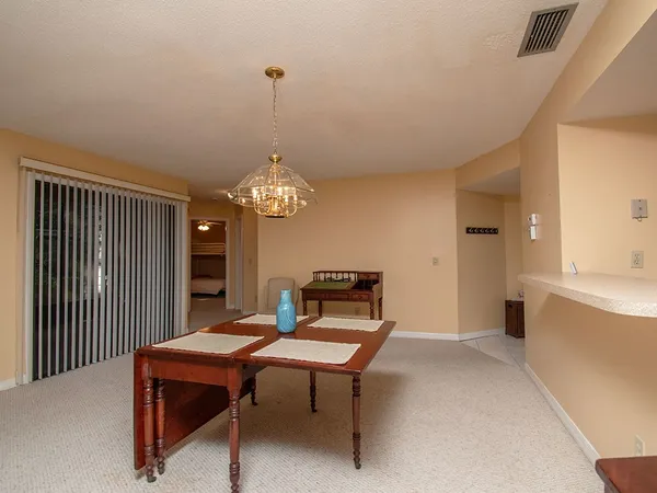a view of a livingroom with furniture and window