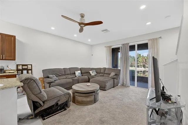 a spacious bedroom with a bed and a couch