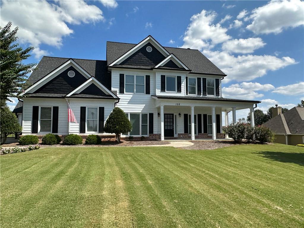 128 Ridge Mill Lane Commerce, GA 30529 - Photo 1 of 1 a front view of a house with a yard