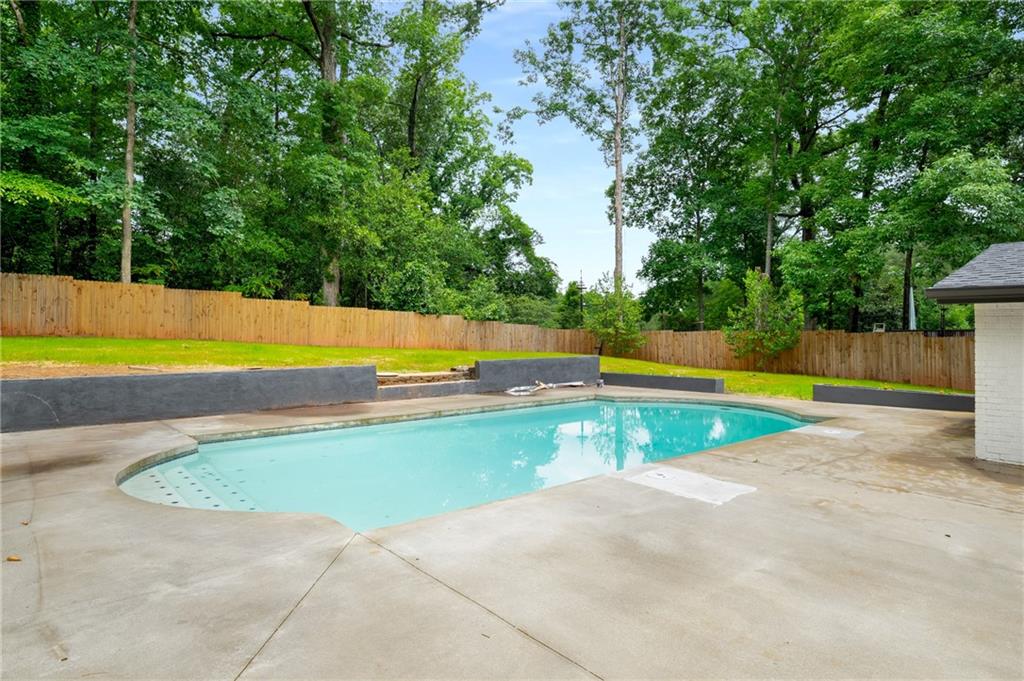 3154 North Druid Hills Road Northeast Decatur, GA 30033 - Photo 12 of 82 a view of a swimming pool and an outdoor space