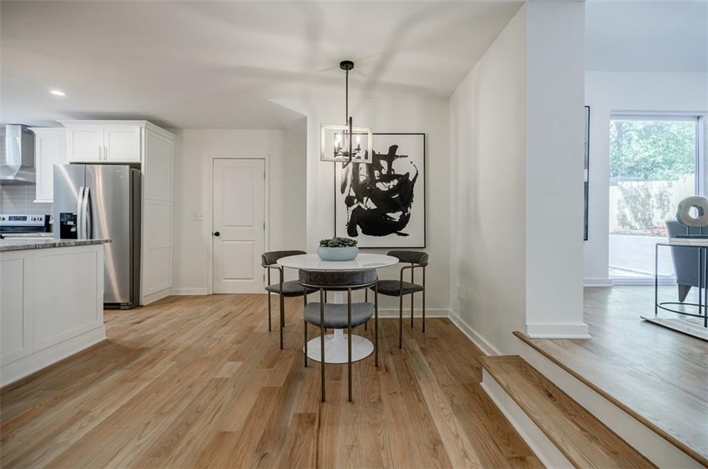 3154 North Druid Hills Road Northeast Decatur, GA 30033 - Photo 37 of 82 a view of a dining room with furniture window and wooden floor