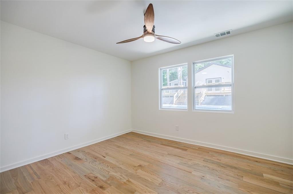 3154 North Druid Hills Road Northeast Decatur, GA 30033 - Photo 50 of 82 wooden floor in an empty room with a window