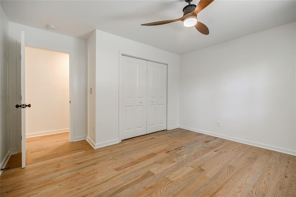 3154 North Druid Hills Road Northeast Decatur, GA 30033 - Photo 51 of 82 an empty room with wooden floor cabinet and windows