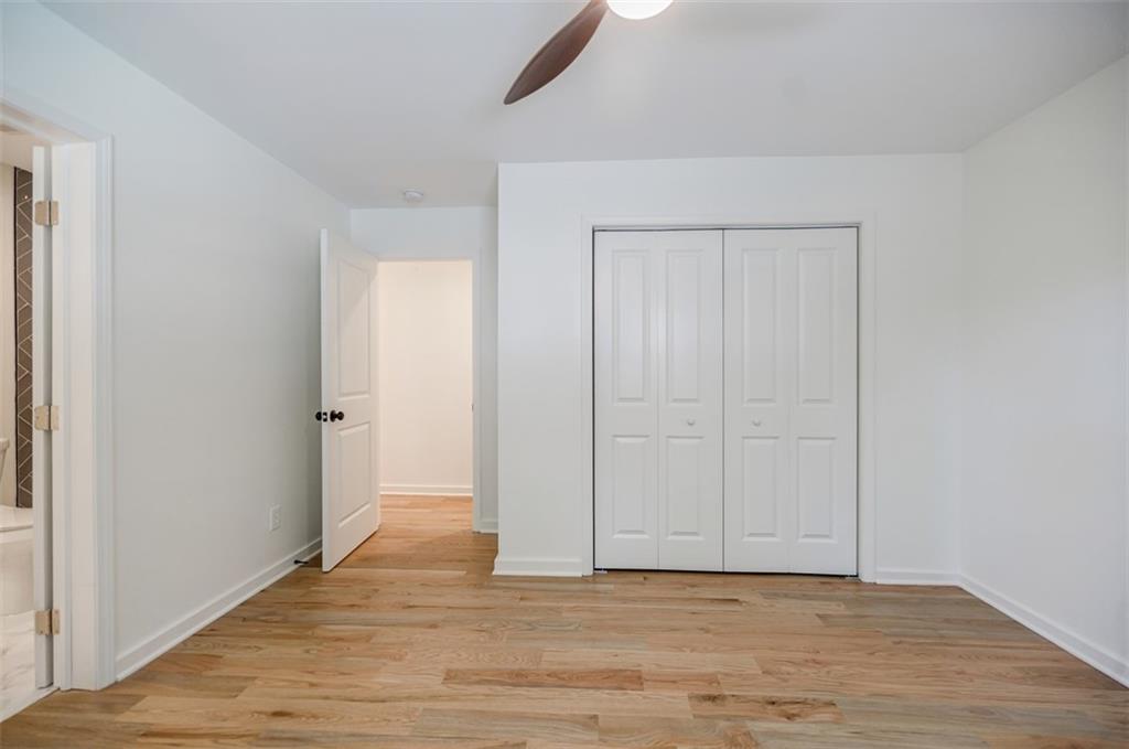 3154 North Druid Hills Road Northeast Decatur, GA 30033 - Photo 52 of 82 a view of an empty room with wooden floor