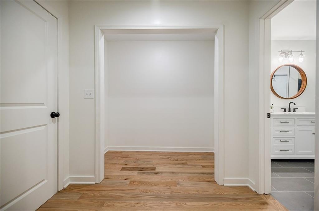 3154 North Druid Hills Road Northeast Decatur, GA 30033 - Photo 63 of 82 a bathroom with a sink vanity and a mirror