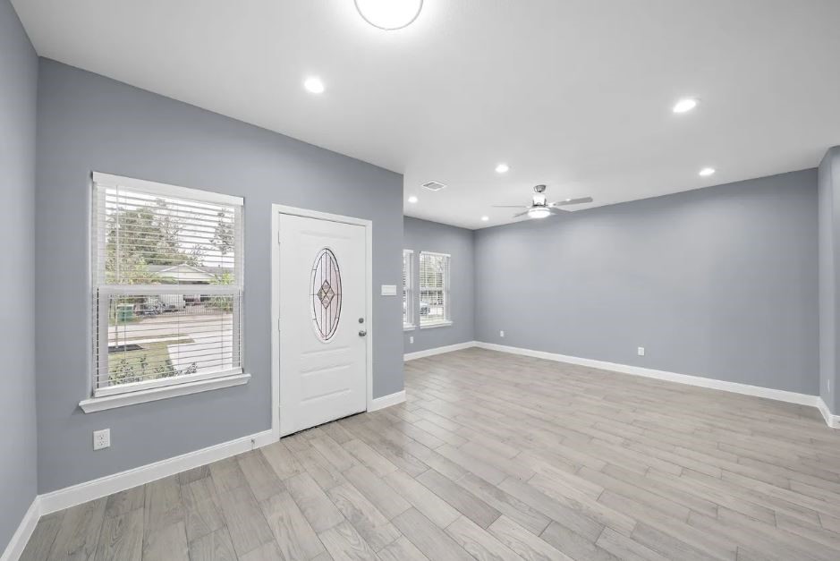 5222 Bataan Road Houston, TX 77033 - Photo 19 of 22 Bright open-concept living area featuring sleek finishes, recessed lighting, and a refined modern aesthetic.