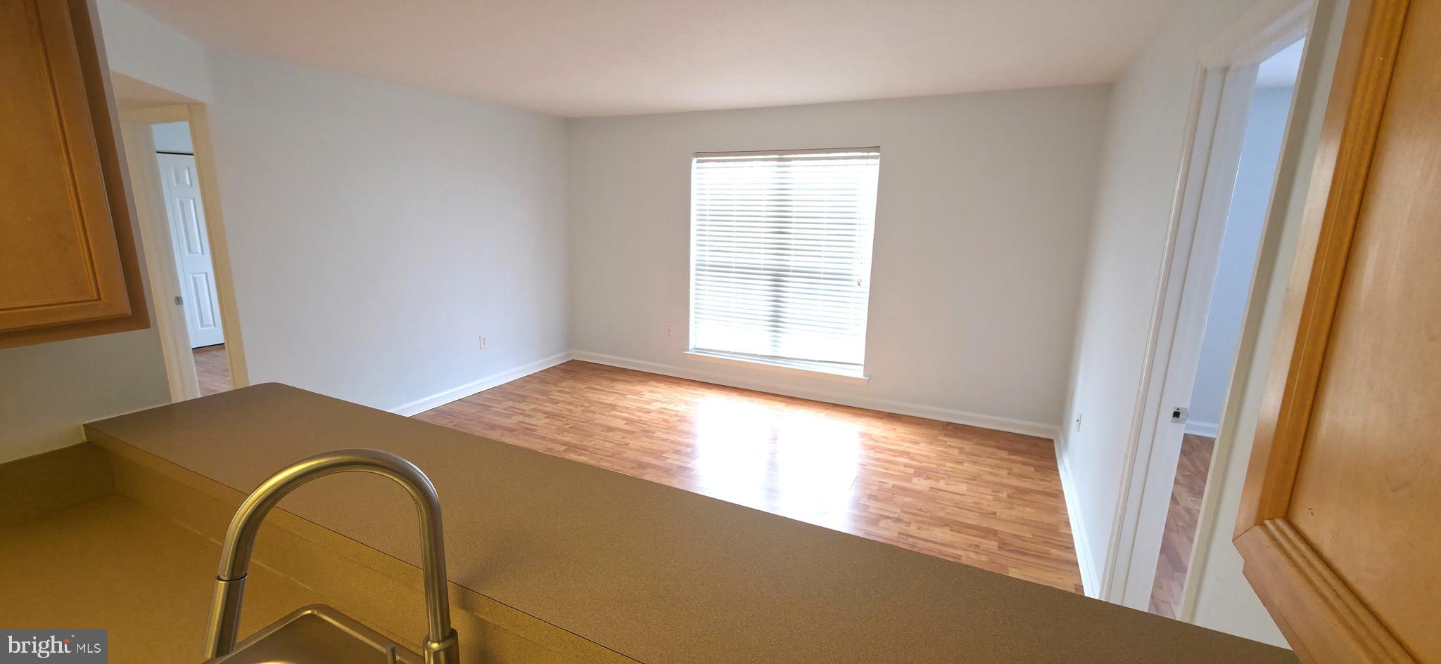 11228 Torrie Way, Unit G Bealeton, VA 22712 - Photo 11 of 30 a view of an empty room and window