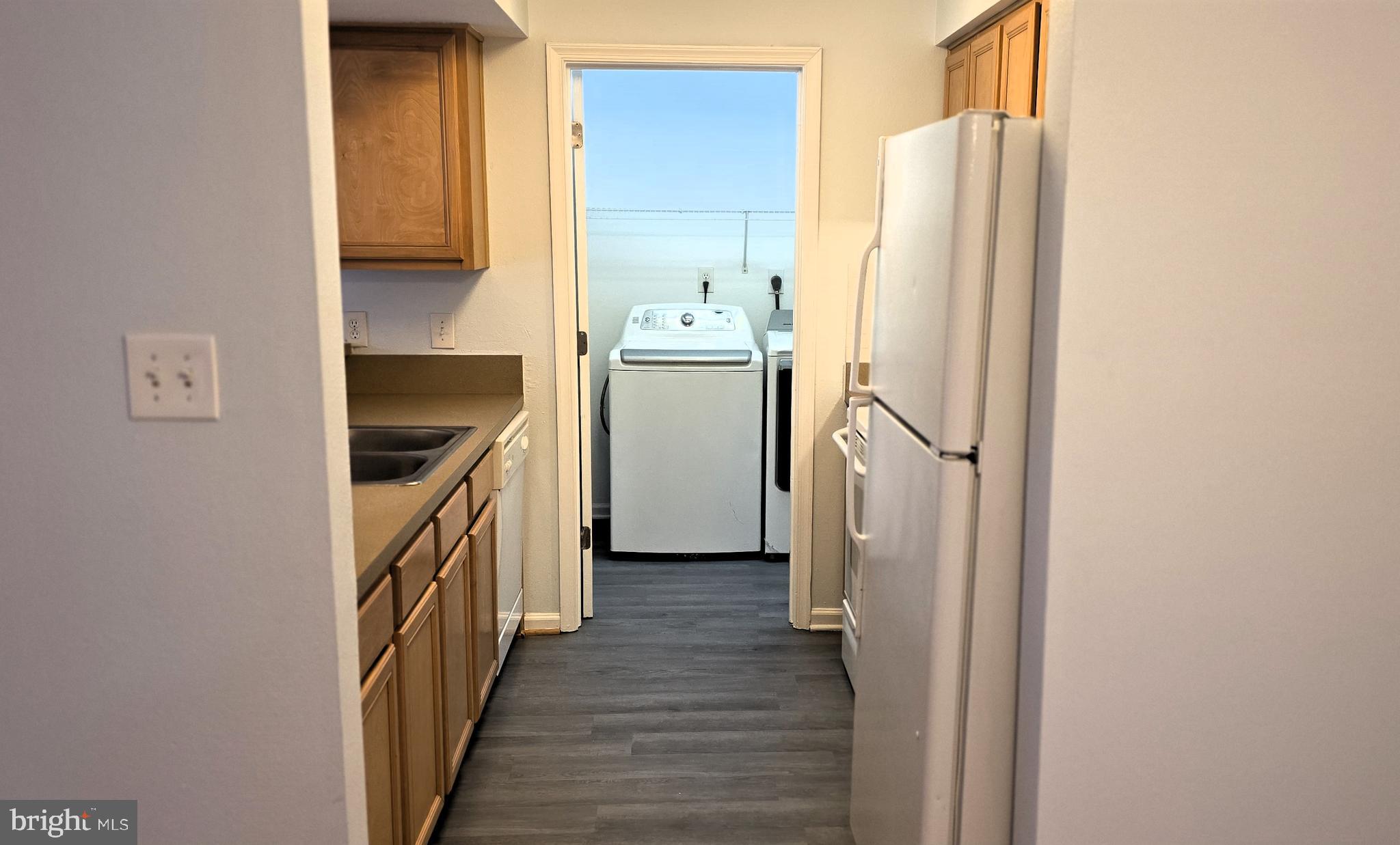 11228 Torrie Way, Unit G Bealeton, VA 22712 - Photo 14 of 30 a kitchen with a refrigerator and a stove