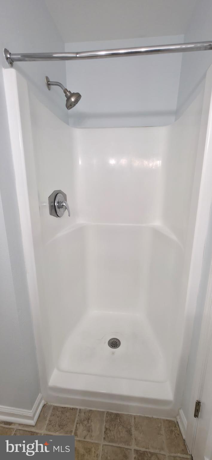 11228 Torrie Way, Unit G Bealeton, VA 22712 - Photo 28 of 30 a bathroom with a shower