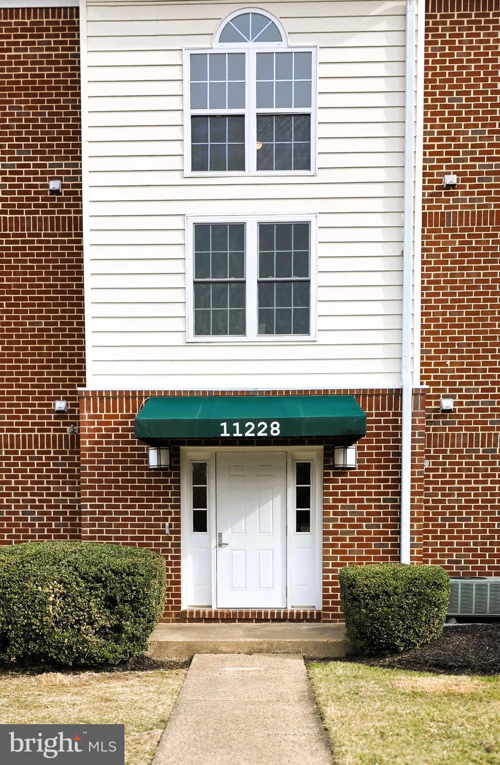 11228 Torrie Way, Unit G Bealeton, VA 22712 - Photo 3 of 30 a front view of a house with a yard