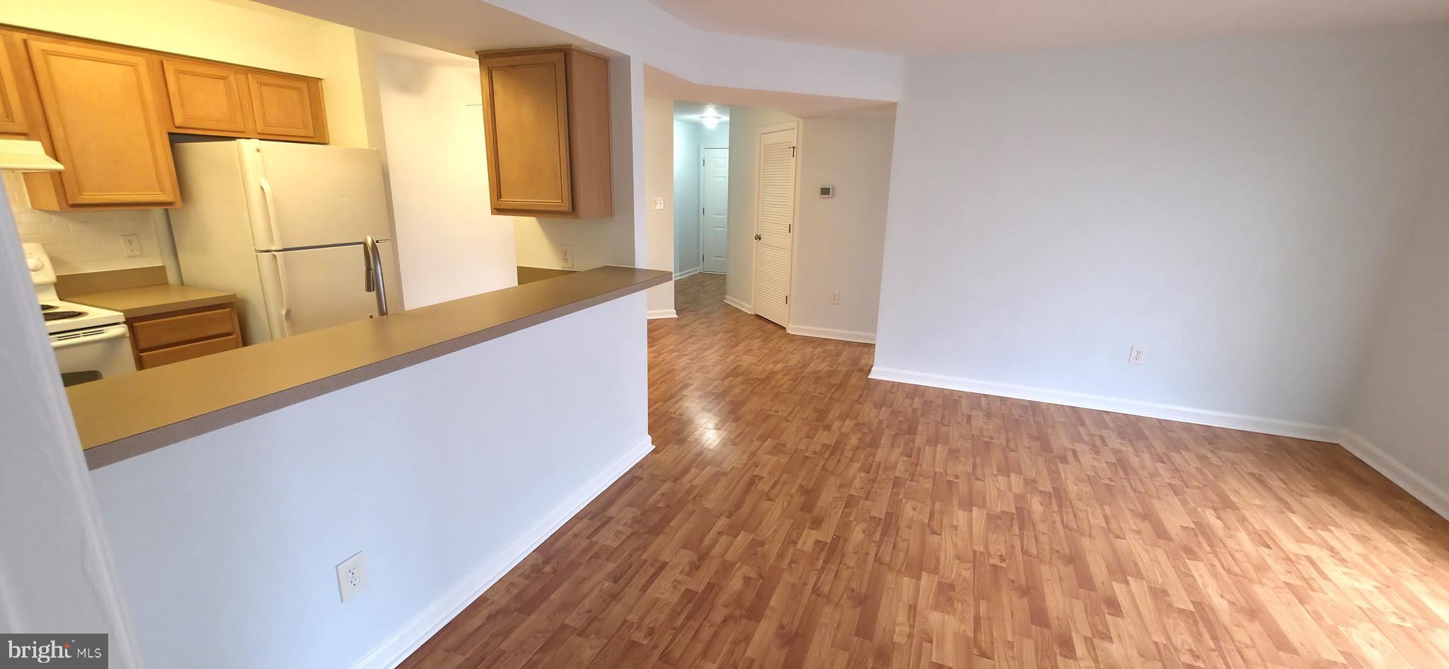 11228 Torrie Way, Unit G Bealeton, VA 22712 - Photo 10 of 30 a hallway with wooden floor