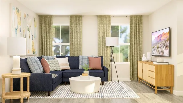 a living room with furniture and a window
