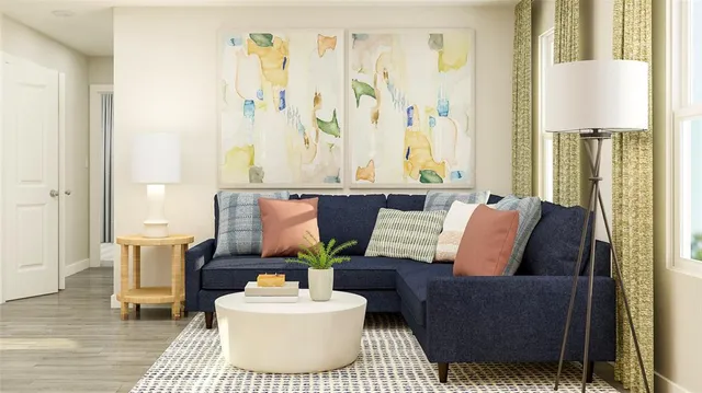 a living room with furniture and a lamp