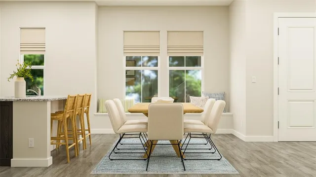 a dining room with furniture and window