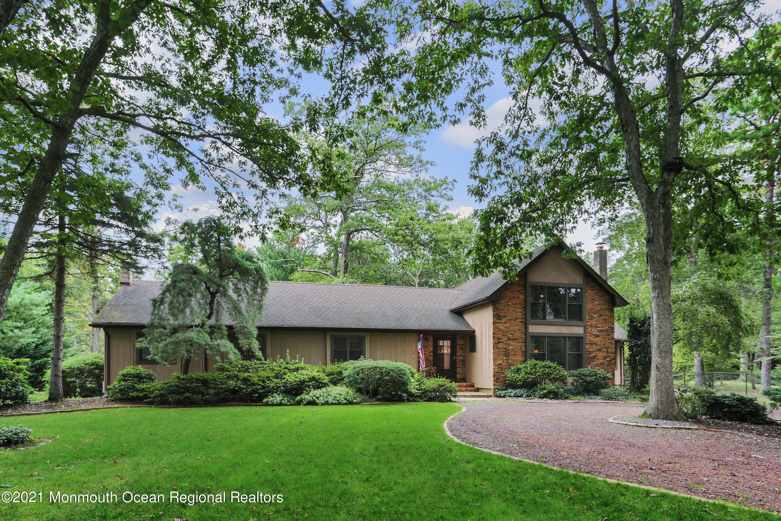 719 Gail Chambers Road Jackson, NJ 08527 - Photo 1 of 34 a front view of a house with a yard and garage