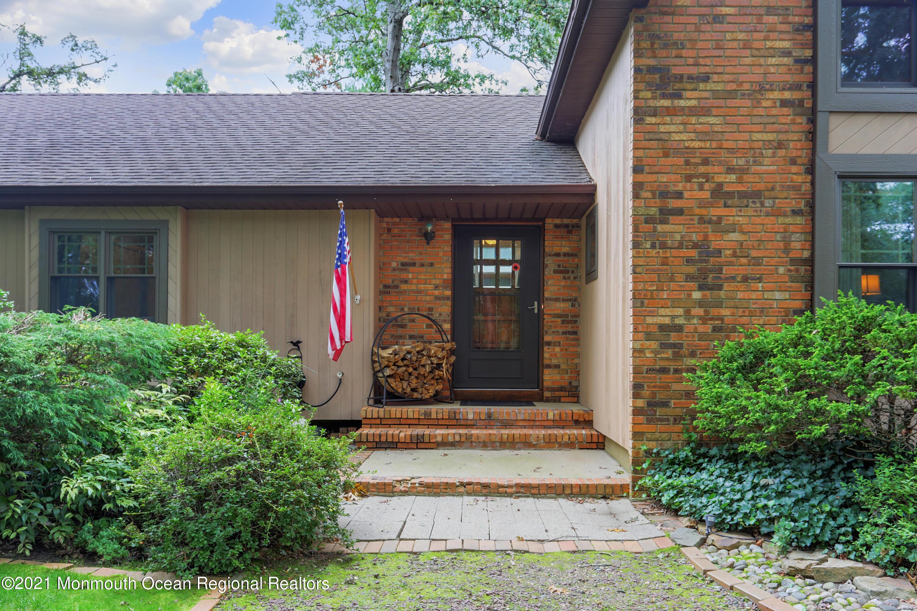 719 Gail Chambers Road Jackson, NJ 08527 - Photo 2 of 34 a front view of a house with garden
