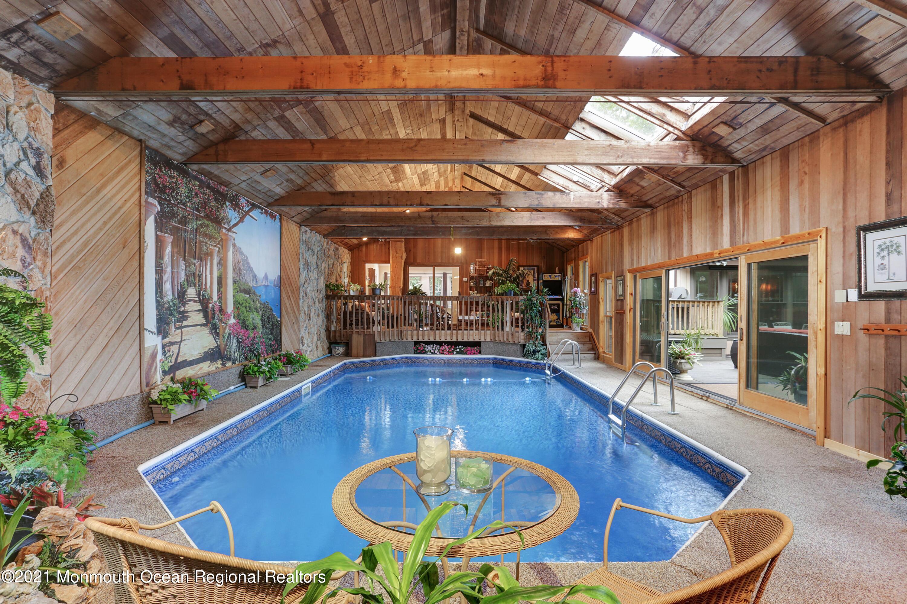 719 Gail Chambers Road Jackson, NJ 08527 - Photo 13 of 34 a view of a swimming pool with a patio