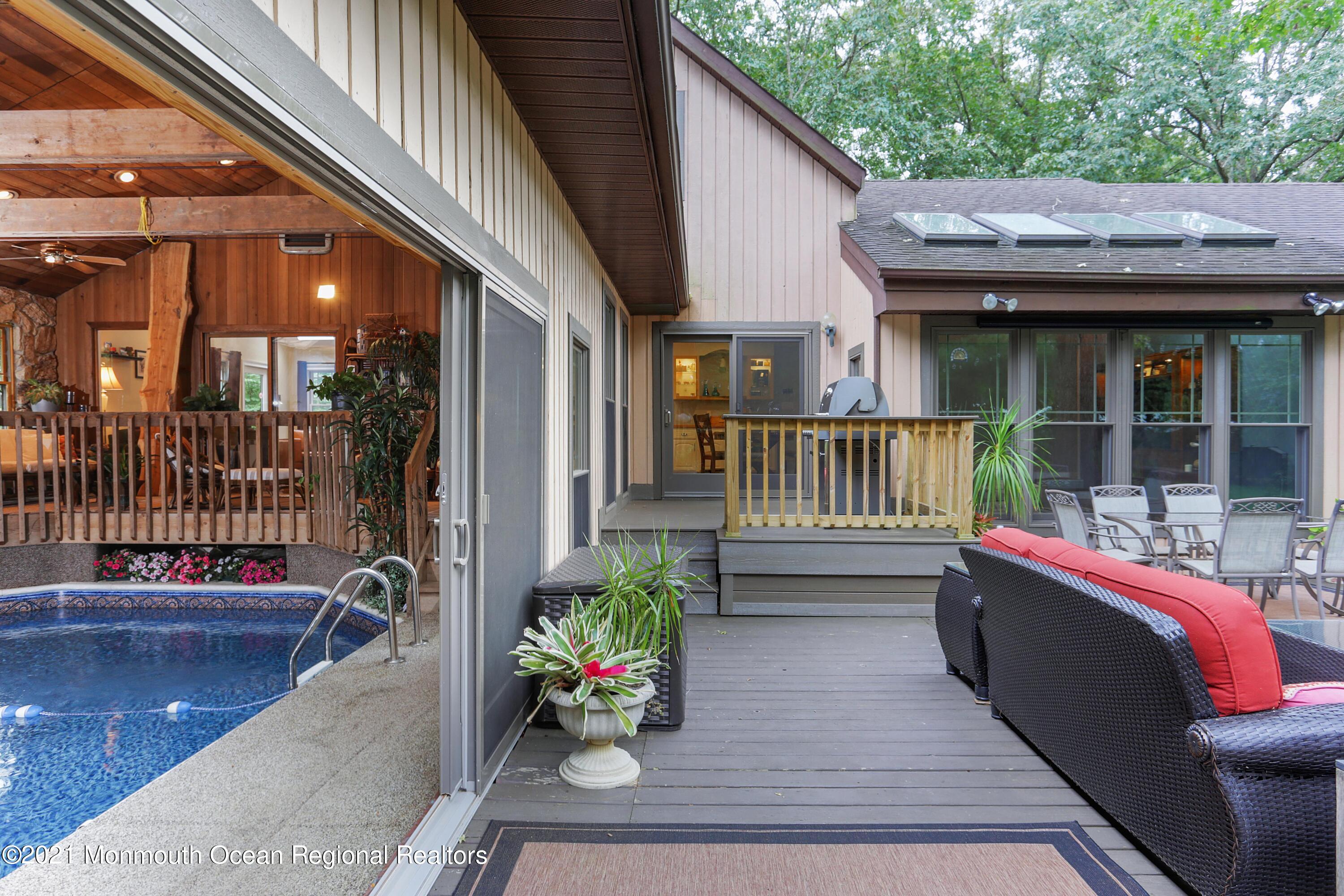 719 Gail Chambers Road Jackson, NJ 08527 - Photo 15 of 34 a view of a patio with couches table and chairs and potted plants