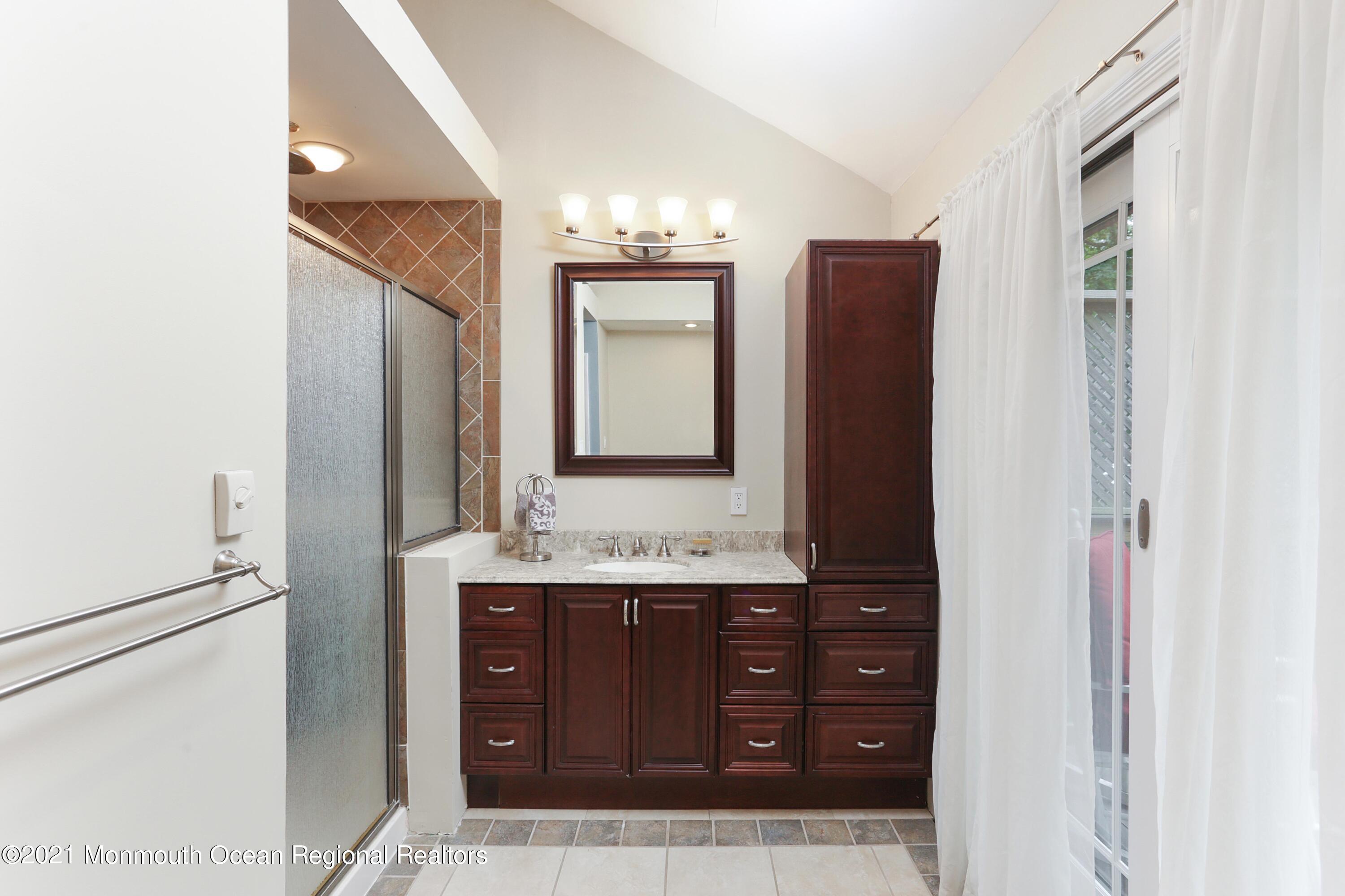 719 Gail Chambers Road Jackson, NJ 08527 - Photo 20 of 34 a bathroom with a double vanity sink and mirror