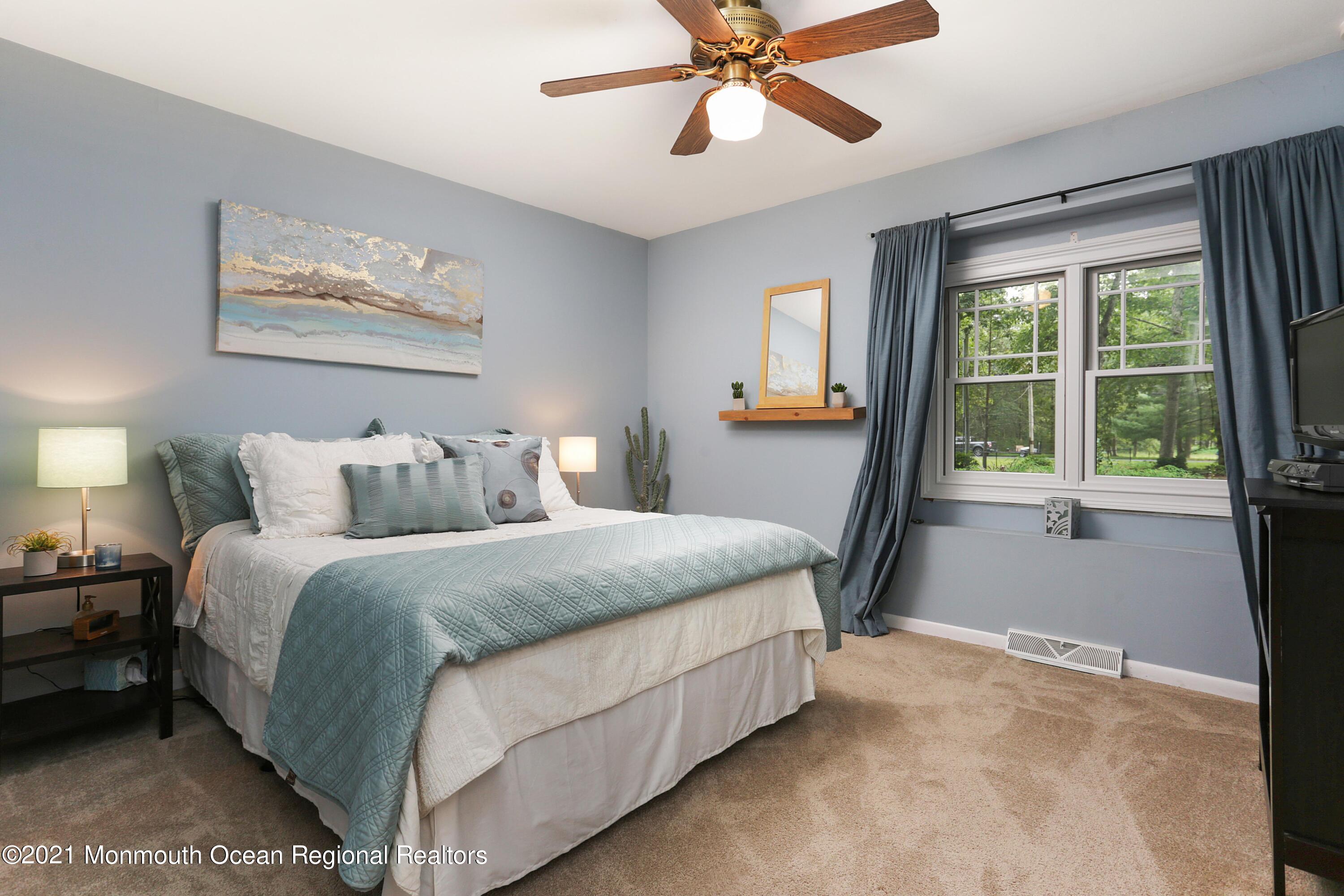 719 Gail Chambers Road Jackson, NJ 08527 - Photo 21 of 34 a bed room with a bed and a window