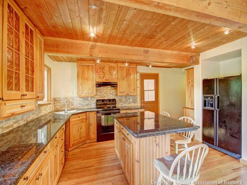224 Spruce Creek Road Breckenridge, CO 80424 - Photo 12 of 21 a kitchen with stainless steel appliances granite countertop a stove and a sink