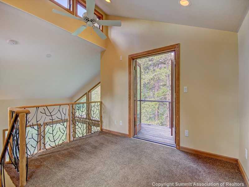 224 Spruce Creek Road Breckenridge, CO 80424 - Photo 14 of 21 wooden floor in an empty room with a window