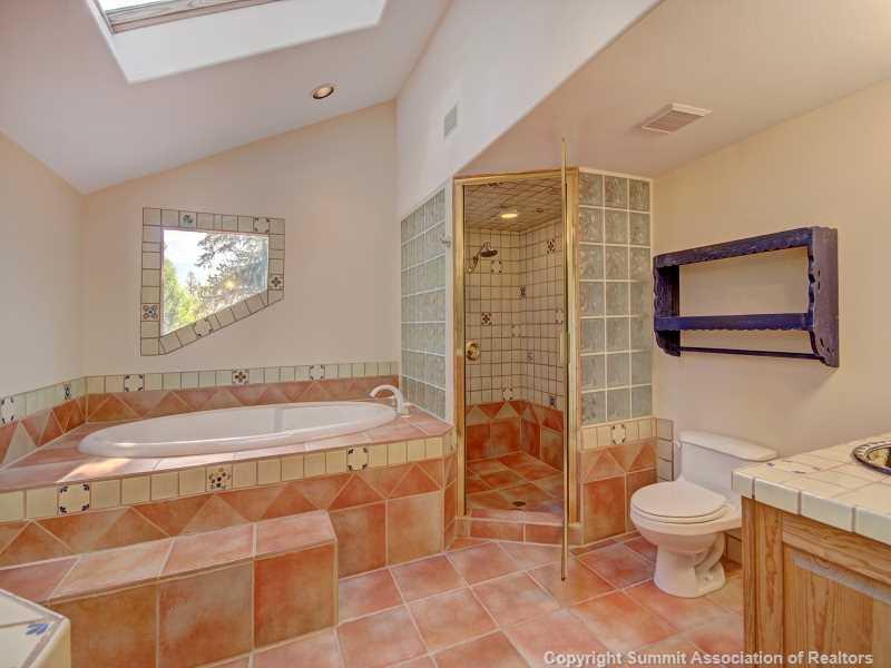 224 Spruce Creek Road Breckenridge, CO 80424 - Photo 18 of 21 a bathroom with a sink toilet and shower