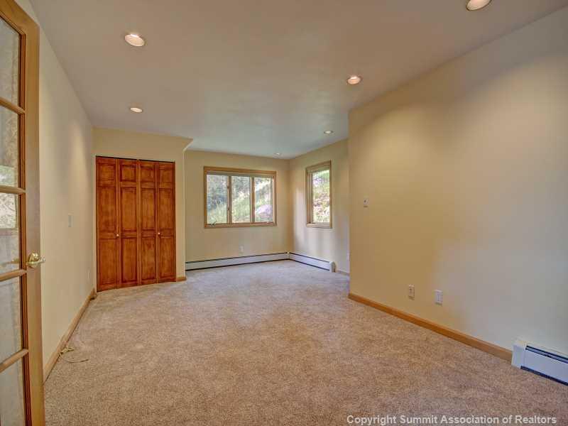224 Spruce Creek Road Breckenridge, CO 80424 - Photo 20 of 21 a view of an empty room with a window