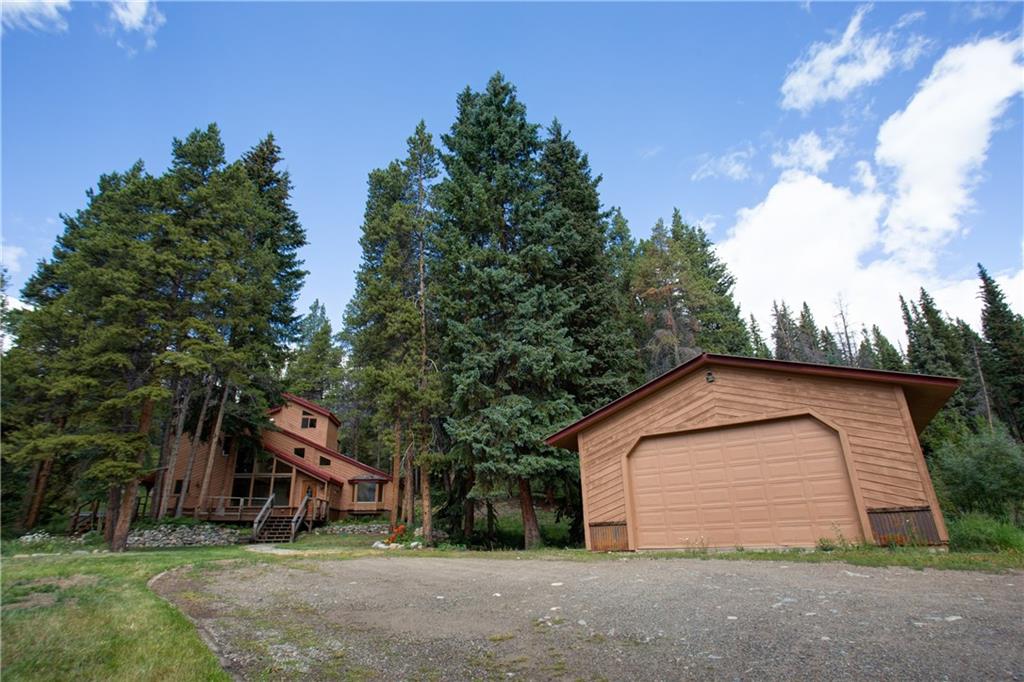 224 Spruce Creek Road Breckenridge, CO 80424 - Photo 8 of 21 a view of backyard of house with large trees