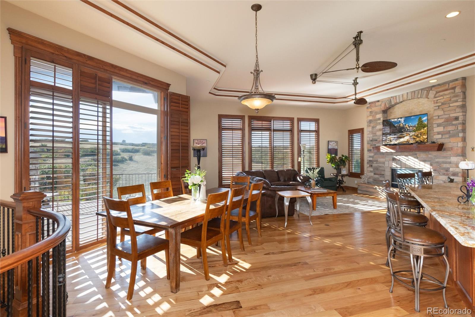 13079 Whisper Canyon Road Castle Pines, CO 80108 - Photo 12 of 50 a view of a dining room with furniture window and outside view