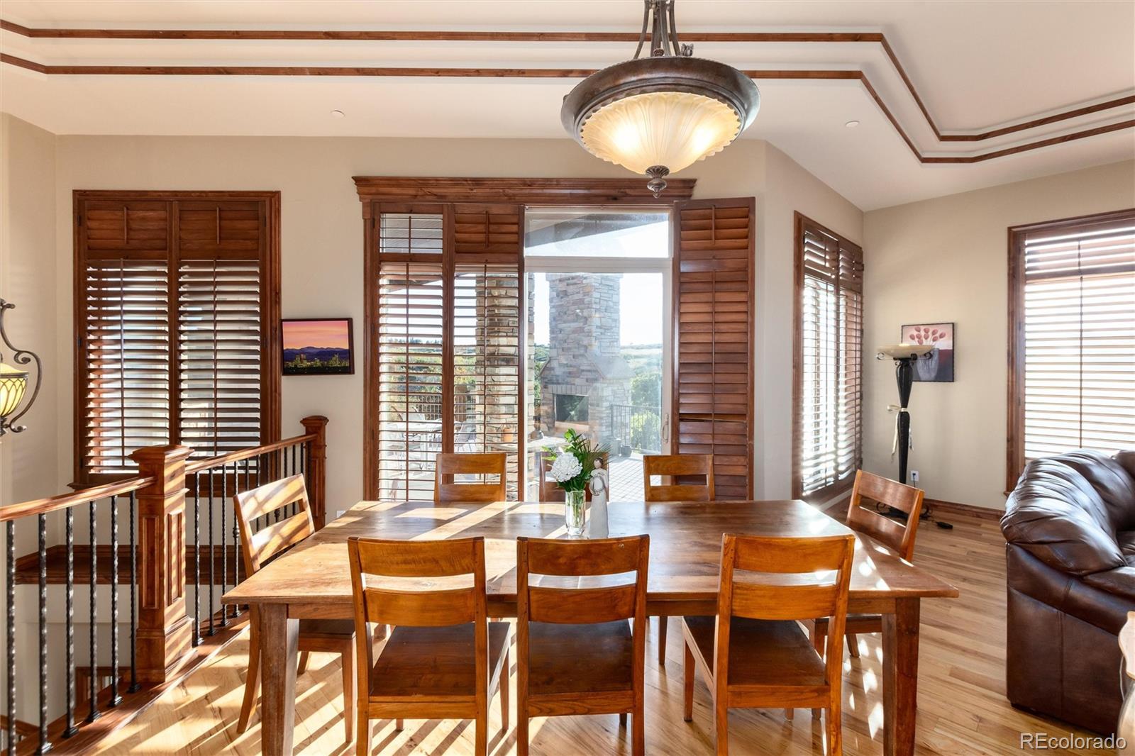 13079 Whisper Canyon Road Castle Pines, CO 80108 - Photo 14 of 50 a view of a dining room with furniture window and outside view