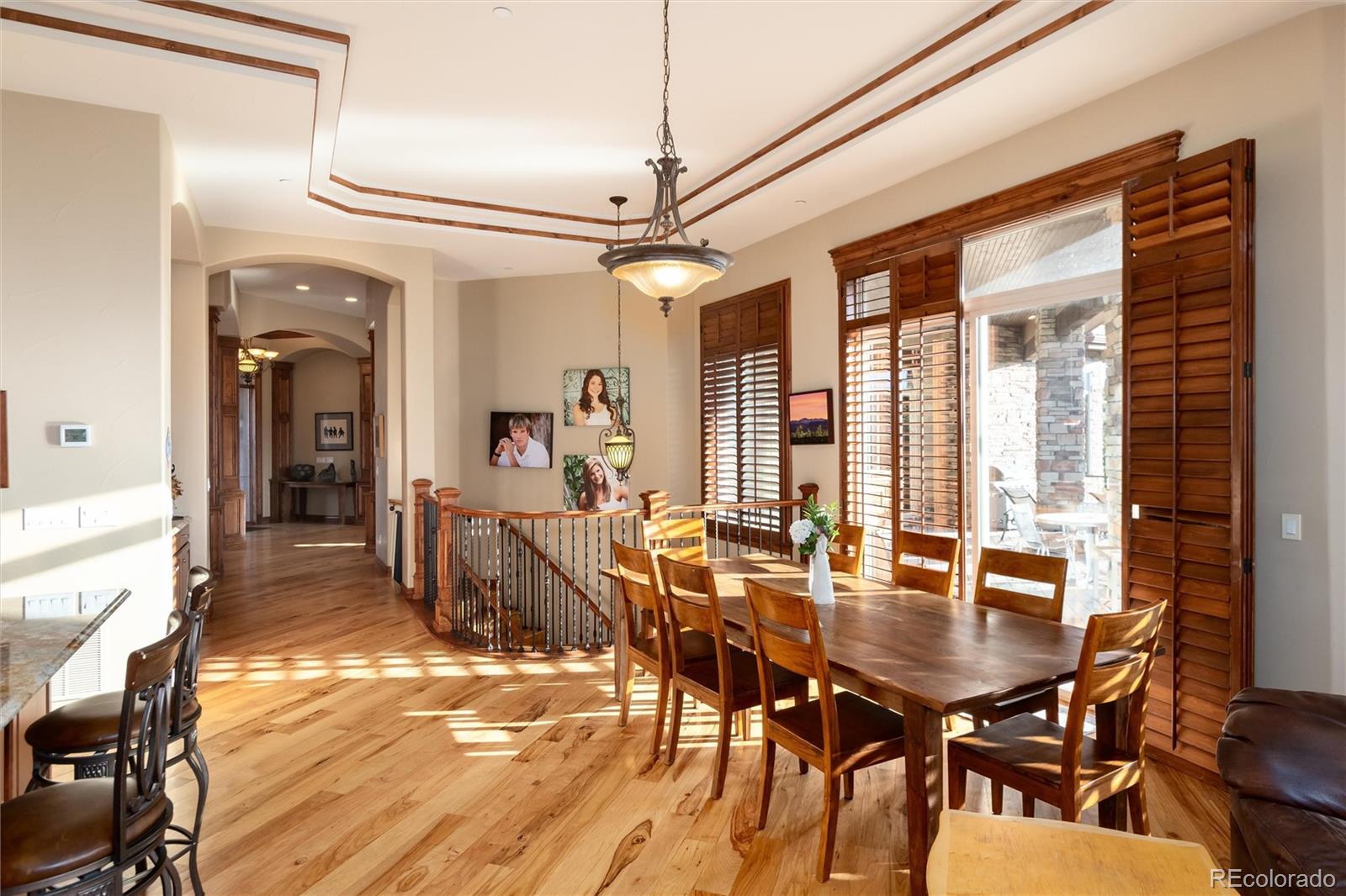 13079 Whisper Canyon Road Castle Pines, CO 80108 - Photo 15 of 50 a dining room with furniture and window