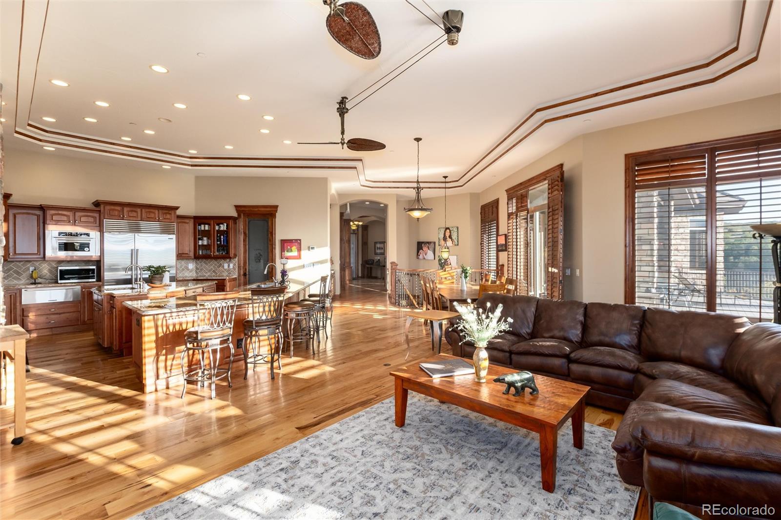 13079 Whisper Canyon Road Castle Pines, CO 80108 - Photo 19 of 50 a living room with furniture and a large window