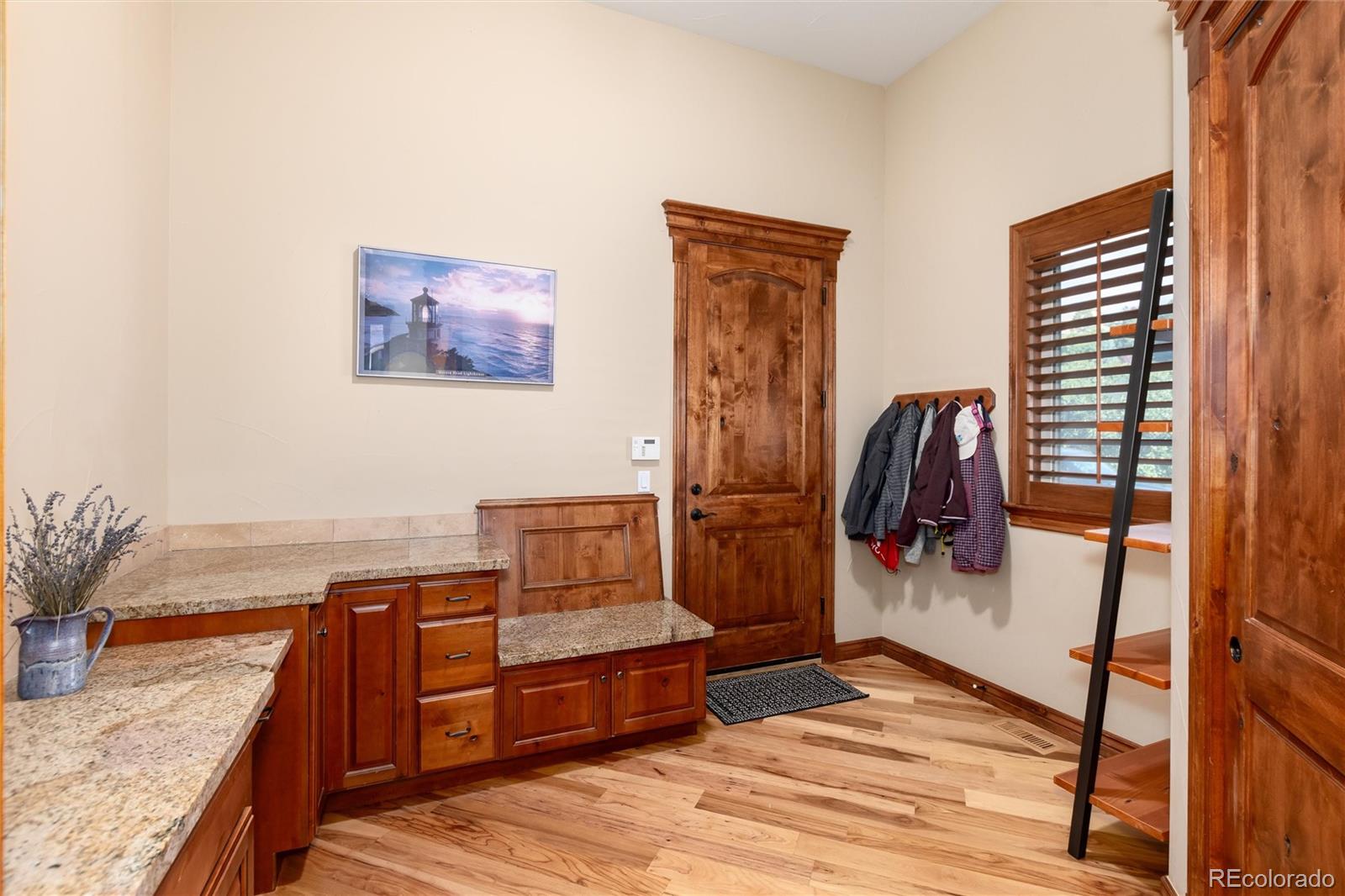 13079 Whisper Canyon Road Castle Pines, CO 80108 - Photo 21 of 50 a bedroom with furniture and a window