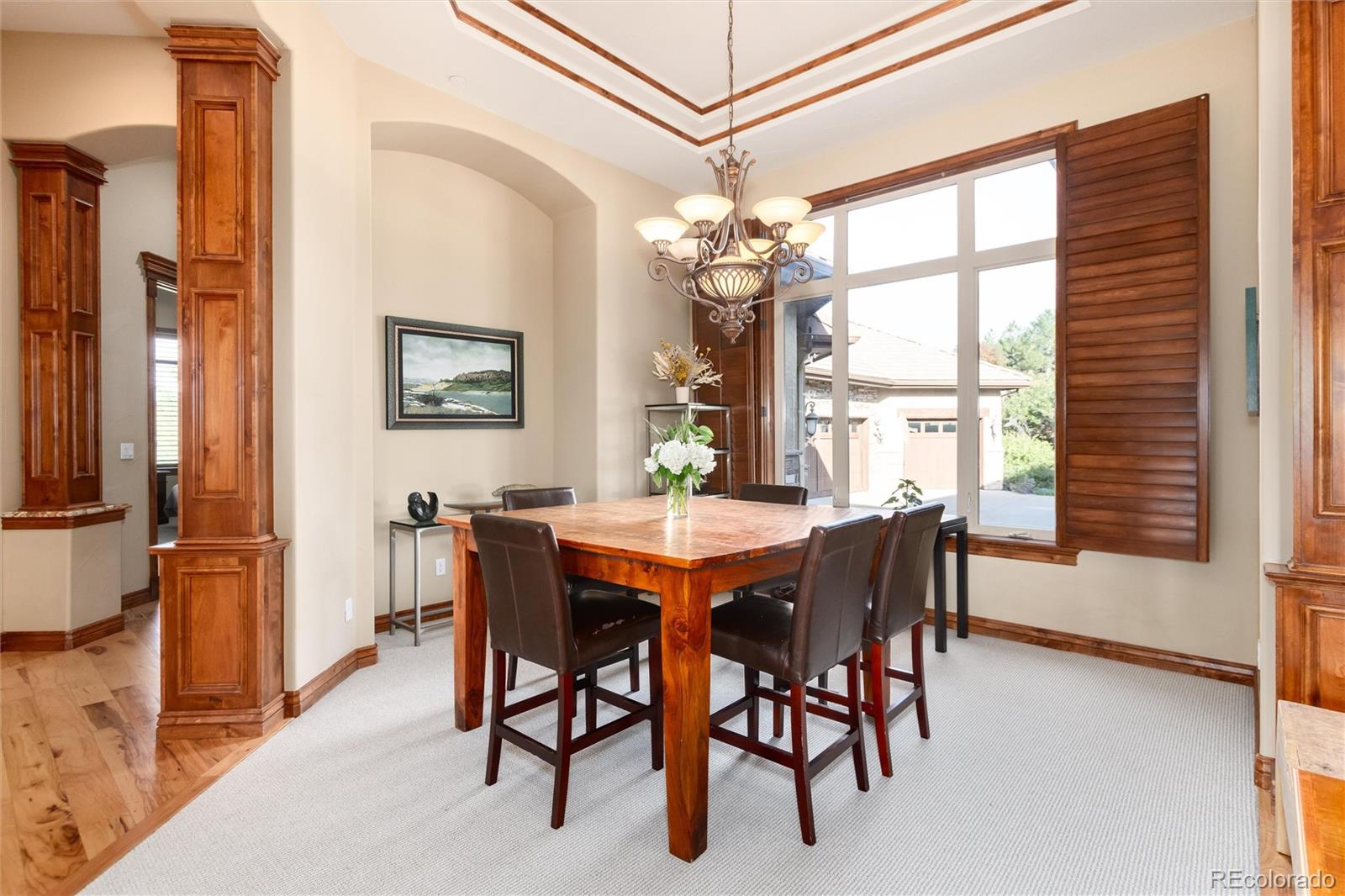 13079 Whisper Canyon Road Castle Pines, CO 80108 - Photo 22 of 50 a view of a dining room with furniture window and outside view