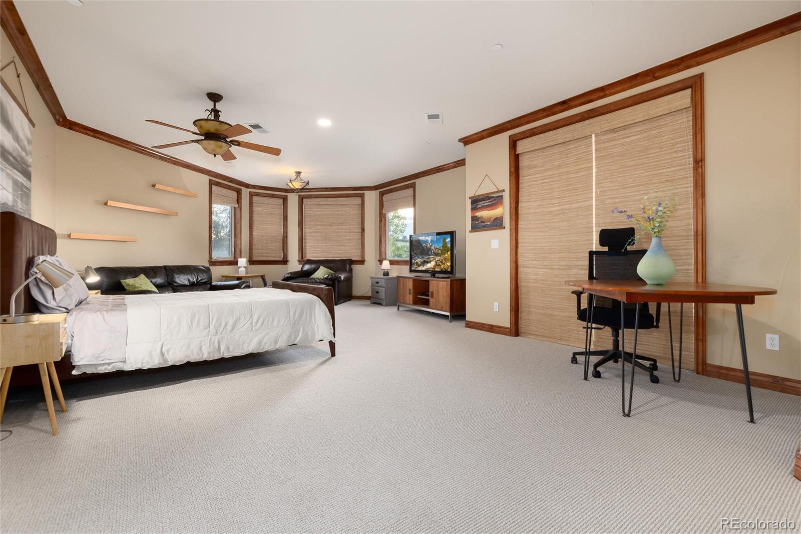 13079 Whisper Canyon Road Castle Pines, CO 80108 - Photo 37 of 50 a bedroom with furniture and a window