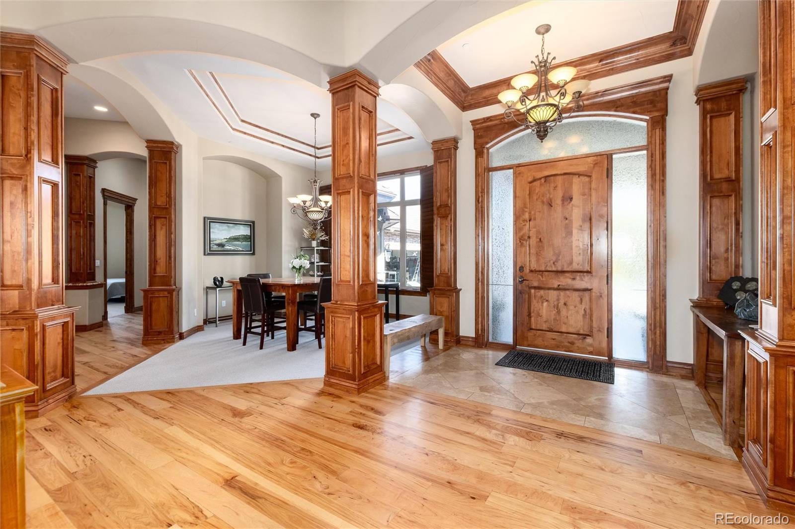 13079 Whisper Canyon Road Castle Pines, CO 80108 - Photo 5 of 50 a view of a livingroom with furniture and a table