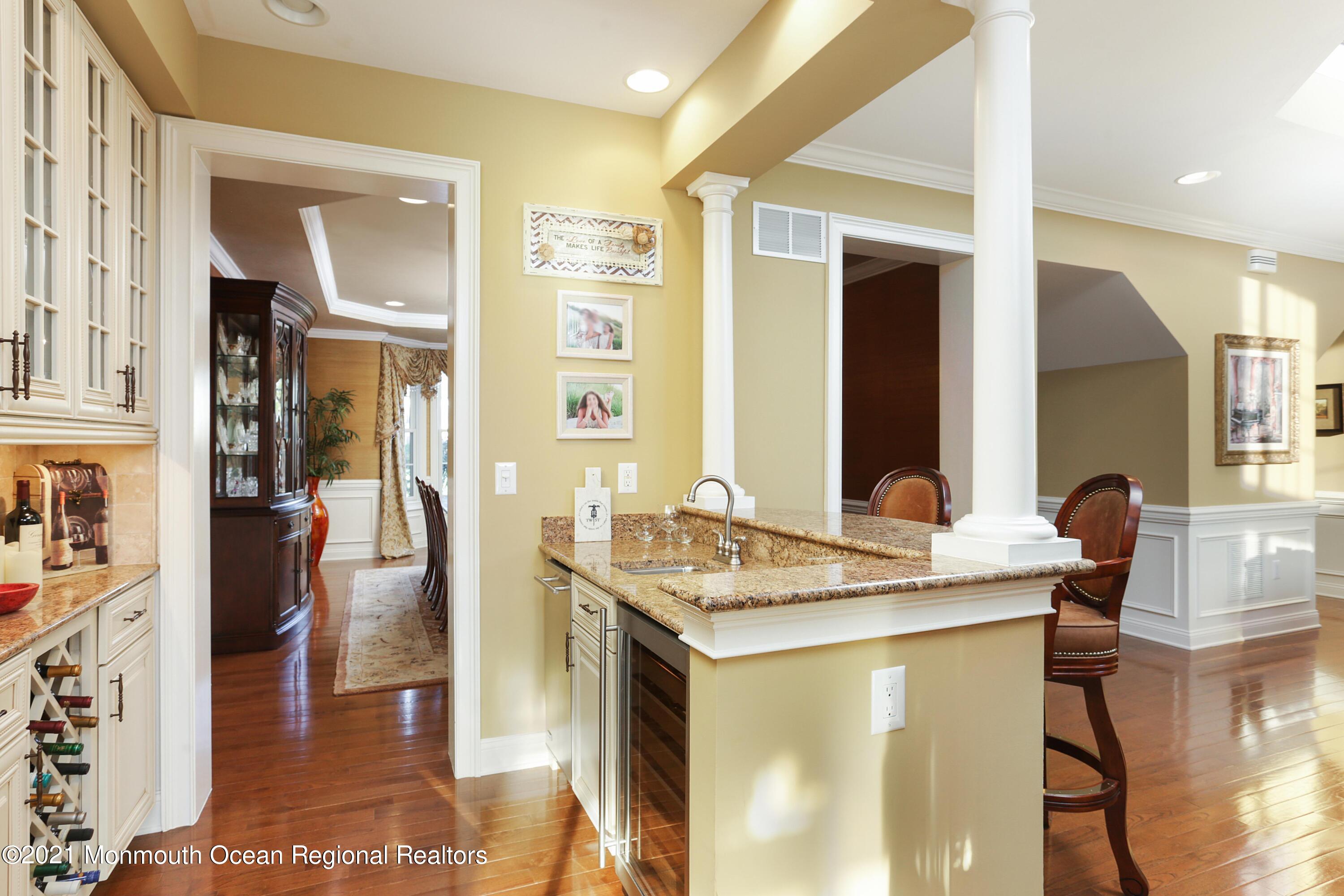 4 Yorktown Road Morganville, NJ 07751 - Photo 17 of 64 a view of living room with granite countertop furniture and fireplace