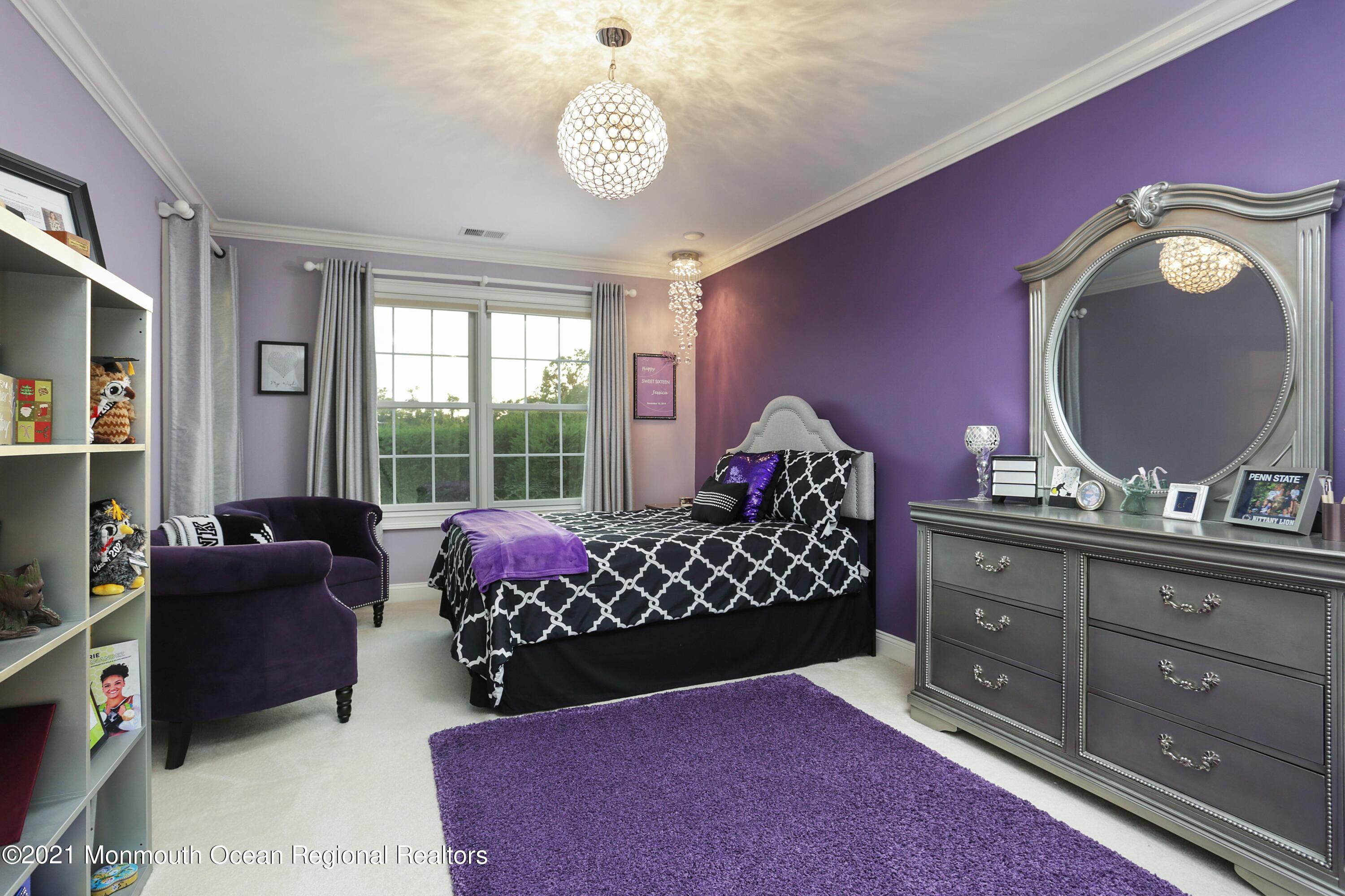 4 Yorktown Road Morganville, NJ 07751 - Photo 30 of 64 a bed room with a bed mirror and a window