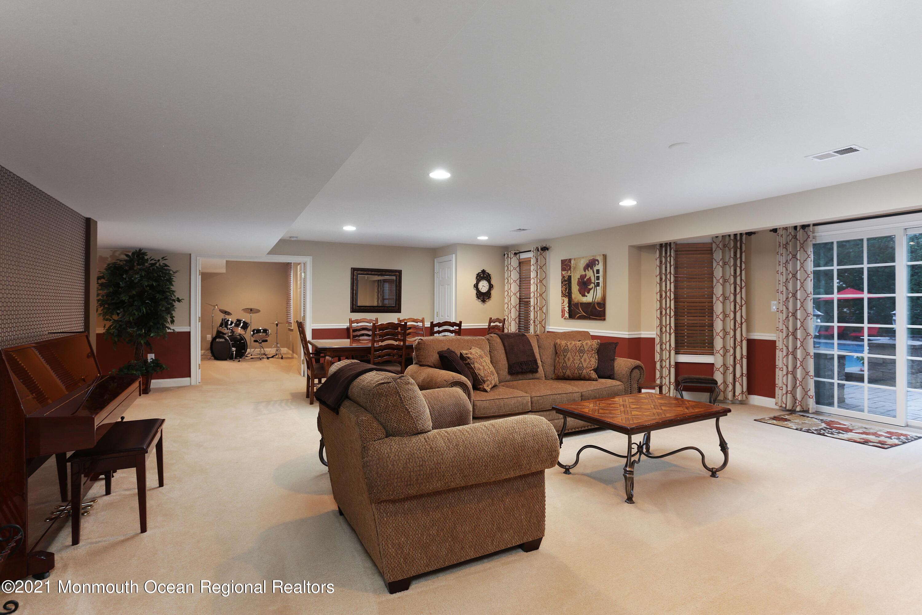 4 Yorktown Road Morganville, NJ 07751 - Photo 39 of 64 a living room with furniture and a window